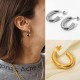 Elliptical C-shaped hollow circular steel earrings