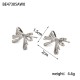 Stainless steel earrings with line pattern bow and tie