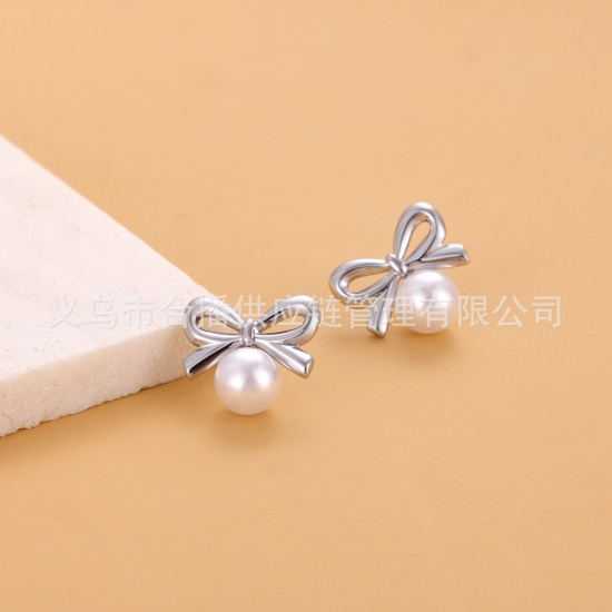 Bow shaped pearl stainless steel earrings