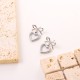 Hollow out heart-shaped bow stainless steel earrings