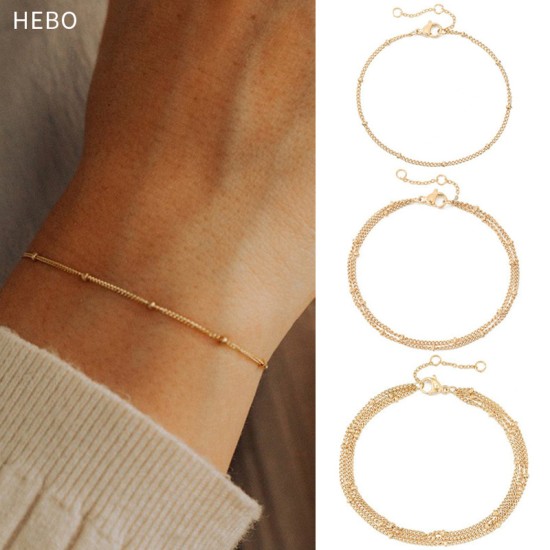 Stainless steel bracelet with laminated clip beads